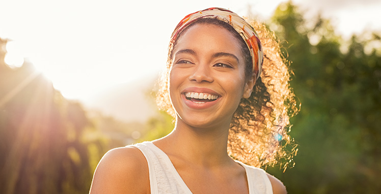 Woman smiling in the sunlight