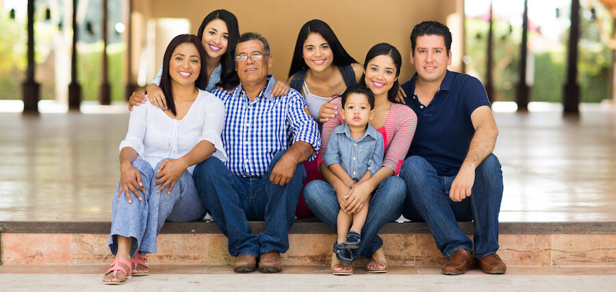 Multigenerational latin family with a child, teens, young adult, parents, and senior grandpa