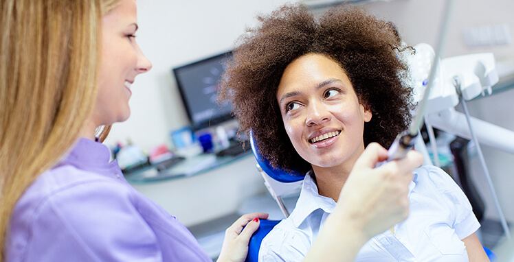 woman talking with her dentist