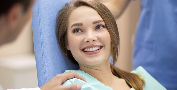 teenage girl sitting in a dental chair
